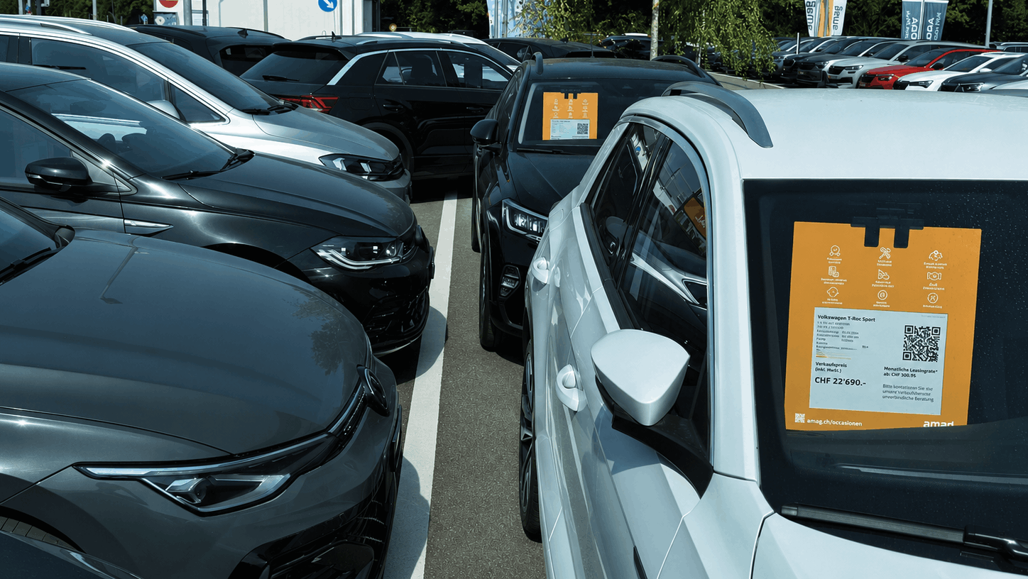 Close-up of a sepioo® Cellular digital vehicle price display installed inside an AMAG vehicle.